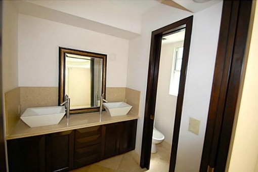 A bathroom with ebonized cherry wood and marble