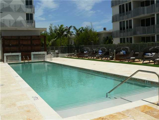 Common swimming pool with comfortable chaise longue