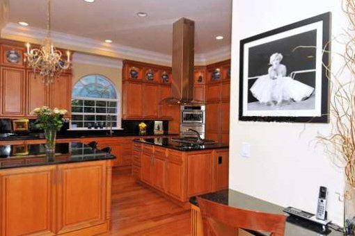 Wooden kitchen with breakfast bar and island