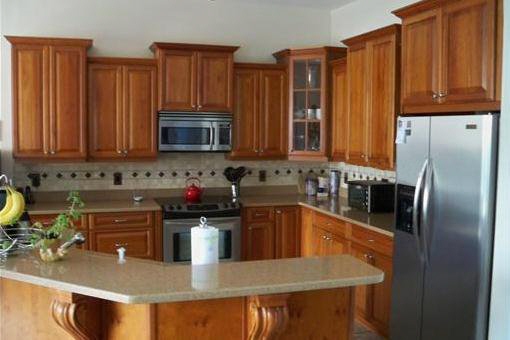 Kitchen with cherry cabinetry