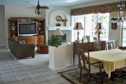 Living room with dining nook overlooking the pool