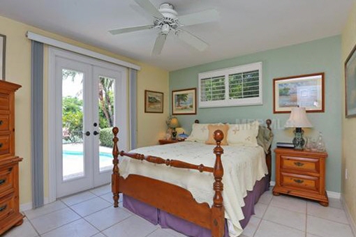 Main bedroom with large wooden bed
