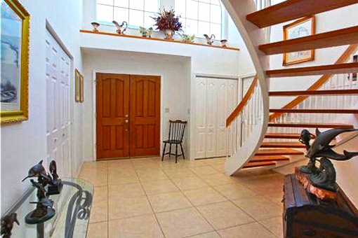 Spacious hall with a staircase to second floor