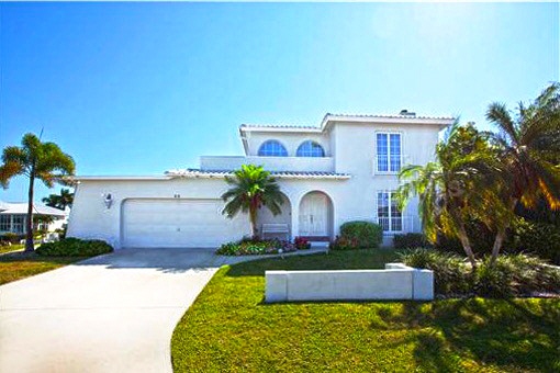 Large house with a pool and private dock