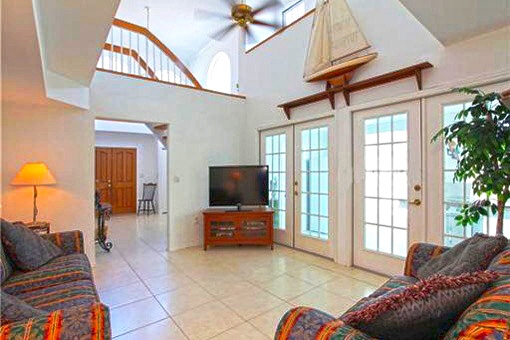 Bright living room with staircase to second floor