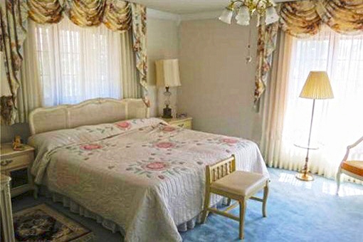 The one of the two beautiful master bedrooms