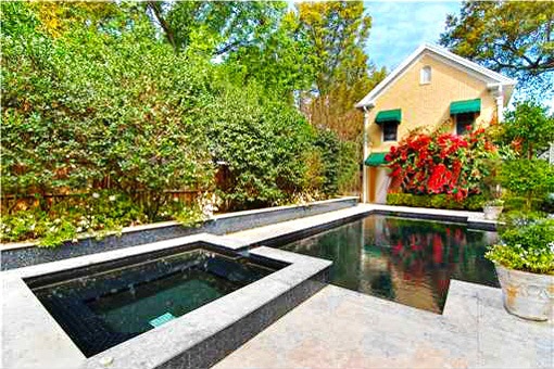Beautiful swimming pool surrounded by garden