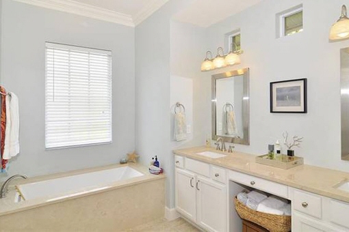 Tiled bathroom with bathtub in Fort Myers 