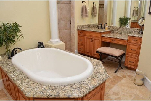 Luxurious bathroom with bath and vanity mirror