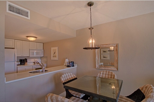 Kitchen with breakfast bar and dining table