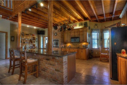Kitchen with breakfast bar and cooking island