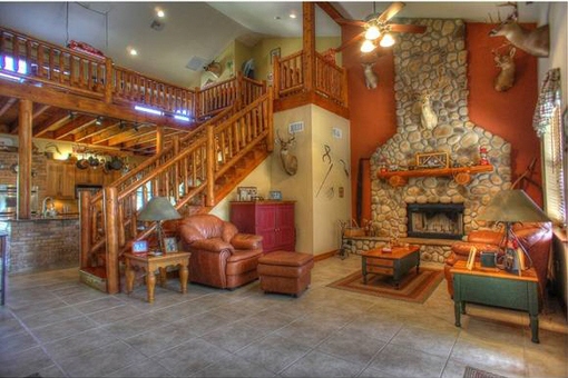 Living room with fireplace and staircase